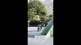 Heartwarming moment boy and his father held young girl wanting to play on older kids' frame