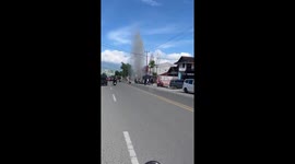 Burst water pipe sprays like a fountain onto road in Indonesia