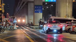 BMW buffoon blocks railway crossing forcing train to stop