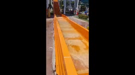 Person falls out of waterslide after being hit by another slider