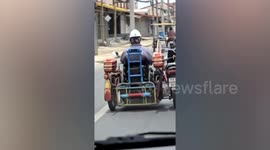 Disabled motorcycle rider modifies vehicle to control it while sitting in sidecar