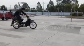 Man loses control during wheelie attempt in Guangxi, China
