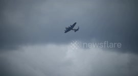 Lone Lancaster Bomber flies over Chelsea when returning to base after the VE day fly past