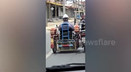 Disabled motorcycle rider modifies vehicle to control it while sitting in sidecar