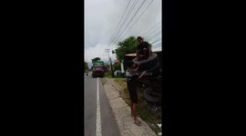 Friends use crashed lorry as a playground ride by spinning on its wheels