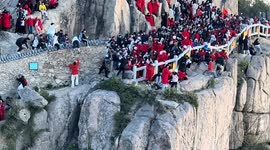 Couple attempting to skip queues tumble down mountainside at tourist hotspot in China