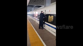 Terrifying moment woman gets stuck in high-speed train door while holding it open for elderly passenger