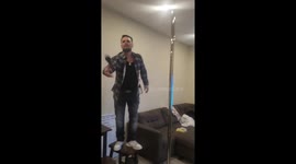 Karaoke singer falls off pole and smashes fish tank