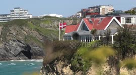 Greenland protest- A micro Island flys Danish flag for a massive Island, Towan Island, Newquay, Cornwall, UK