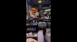 Dog drinks at bar counter in Charleston, South Carolina, USA
