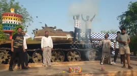 Indians celebrate on tank following air strikes on Pakistan