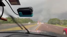 US: Brush fire burning during storm in Palm Bay