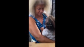 Woman with grey hair holding child compared to Thunder Sister from Croods