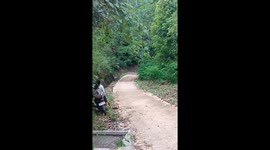 Speeding truck nearly takes out motorcyclist as it roars uphill