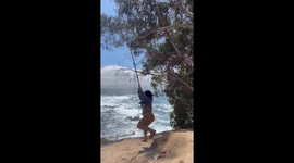 Two Women Struggle During Their Day At the Beach