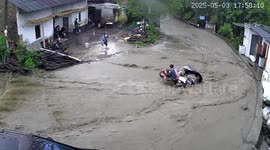 Motorcycle rider and toddler swept away by flash floods on mountain road