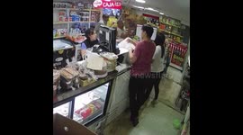 Woman trips and drops bread crate on man in Santiago, Chile