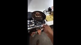 Cook flips dropped food back to pan with foot in Venezuela