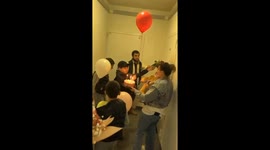 Child playfully pops balloon during surprise in Moscow, Russia