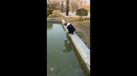 Daredevil walks across frozen pond in China
