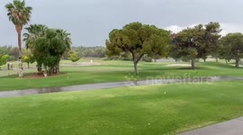 Floodwater flows down golf course greens as rain hits Las Vegas