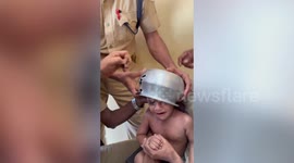Curious toddler gets head stuck in pot, rescue team’s careful effort wins applause