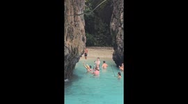 Tourists scolded for feeding monkeys on idyllic Thai island