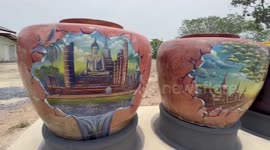 Unused water storage jars decorated with paintings at Buddhist temple