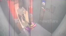Terrifying moment toddler is flung into air after toy car gets caught in elevator doors