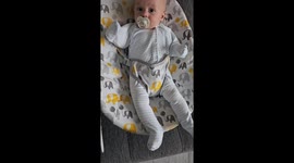 Exhausted dad vs. baby onesie—Hilarious wardrobe fail goes viral with over 4 million views