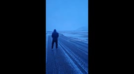 Andøya, Norway: CRAZY winds of storm drag fully-grown man across icy ground