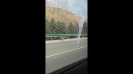 Runaway wheel rolls endlessly along roadside in Qinghai, China