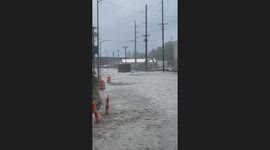 Cars Driving Down Flooded Street in Omaha