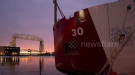 US: Coast Guard Cutter Mackinaw Breaks Ice Under Glowing Sunset In Great Lakes