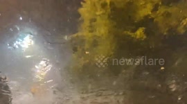 The footage shows severe weather, heavy rain and hail at a Home Depot in West Asheville, US