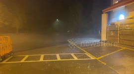 The footage shows severe weather, heavy rain and hail at a Home Depot in West Asheville, US