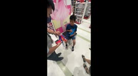 Kind local buys shoes for poor street boy