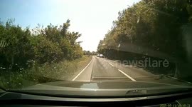 Near miss as car turns across oncoming traffic. Saved by drivers quick reactions