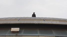 Tom Cruise takes part in a publicity stunt on top of the BFI IMAX late Sunday night to promote his new Mission :Impossible film