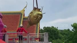 Giant Buddha head falls while being moved at temple