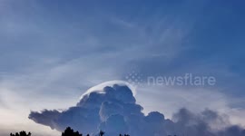 Stunning cloud iridescence seen above mountains in the Philippines