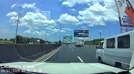 Softdrink truck overturns while overtaking on NLEX in Manila, Philippines