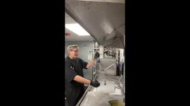 Coworker playfully dunked in bubbly sink at workplace in San Francisco, California