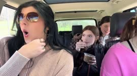 Friends surprised by animals during wildlife park drive in Paoli, Indiana, USA