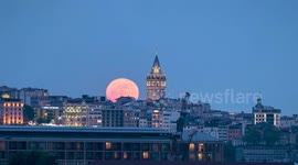 Türkiye: Full moon rises over Galata Tower in Istanbul