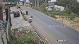 Motorcyclist crashes into parked motorcycle and falls unconscious in Guangdong, China