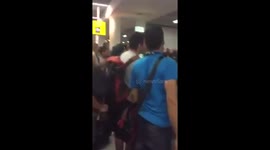 Man knocks multiple police officers to the ground in fight at airport