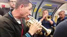 A band cheers up travellers on London Underground train
