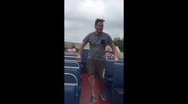 Dad tries to impress kids by dancing on bus, falls over