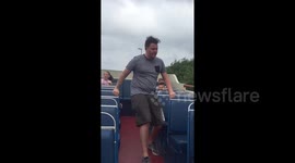 Dad tries to impress kids by dancing on bus, falls over